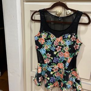 Beautiful sleeveless top with black mesh on top and back and sides very sexy